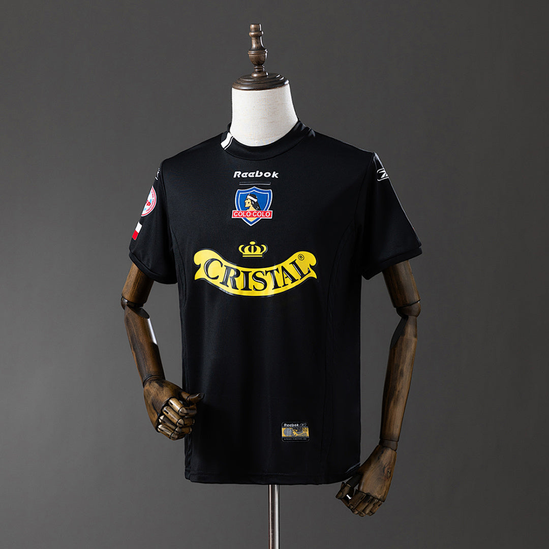 Camiseta Retro Colo Colo Visita Negra y Café 2004 - frente