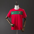 Camiseta Retro Portugal Local Burdeos y Gris 2010 - frente